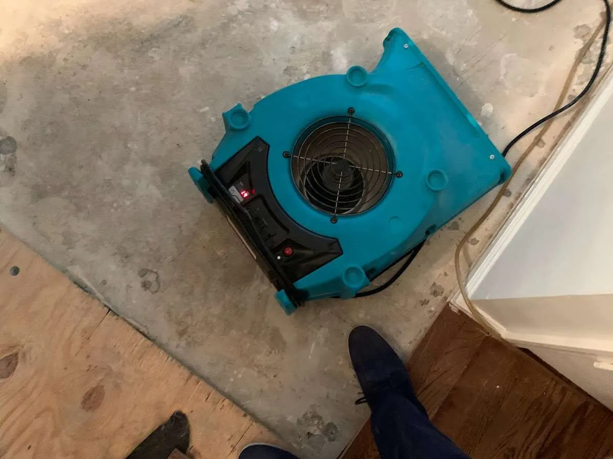 Air mover drying subfloor during Leak Detection & Repair in North Miami Beach